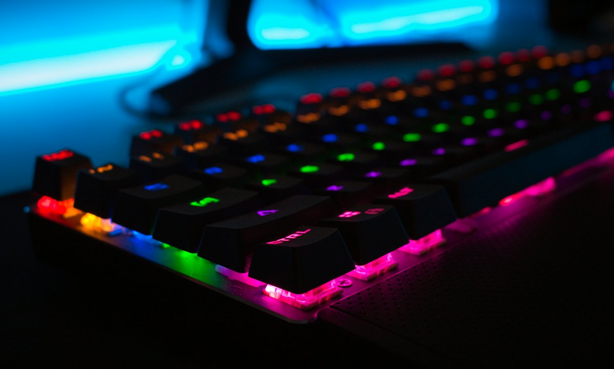 A mechanical keyboard glowing with rainbow backlighting